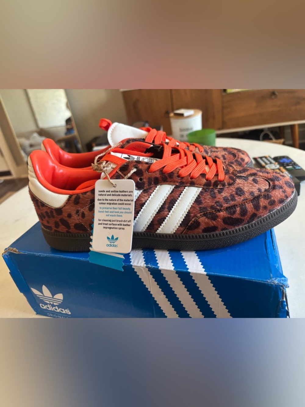 adidas Women’s Leopard Print Sneakers with White Stripes and Orange Accents